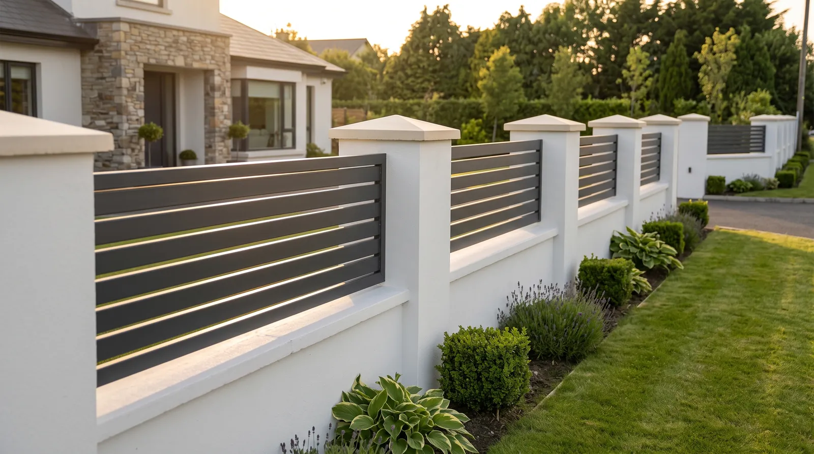 Horizontal steel rail panels in anthracite fitted into the openings of a white rendered wall between pillars