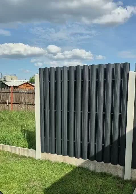 Anthracite vertical picket fence panels fitted between concrete posts
