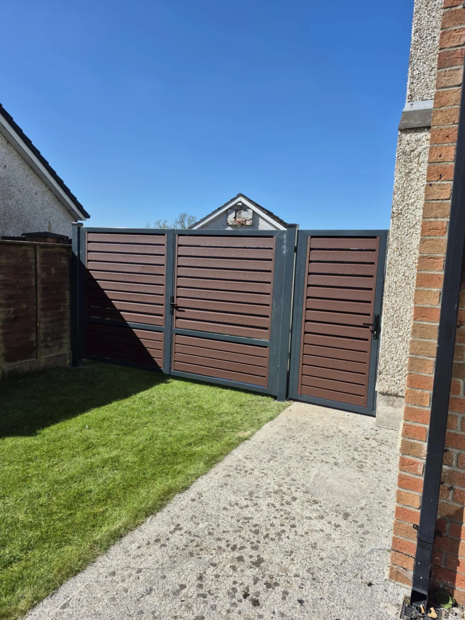 Wood look double gates with matching side gate