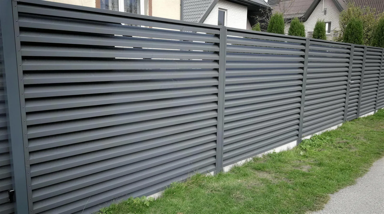 Graphite jalousie louvre fence installed along a footpath